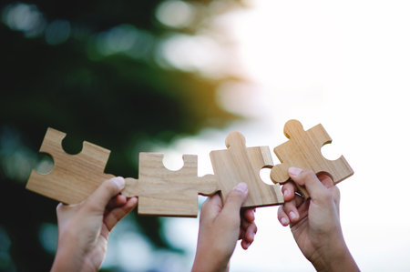 Jigsaw puzzles and collaboration, teamwork and teamwork, teamwork, team goals and success.の写真素材