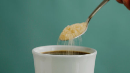 Sugar and Black Coffee Adding sugar to black coffee gives it a nice, sweet taste.の写真素材