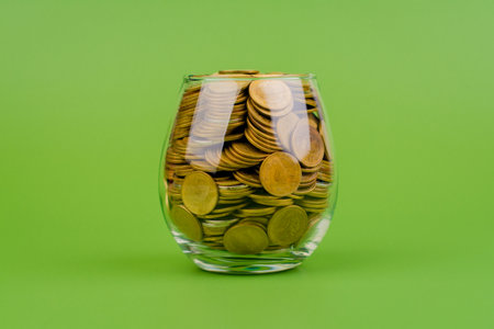 Saving coins in a piggy bank, building good financial discipline, financial planning and investing for the future.の写真素材
