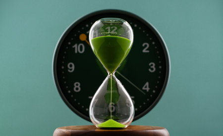 Green Hourglass and Effective Time Management Work and Life Photo Timer in Studio