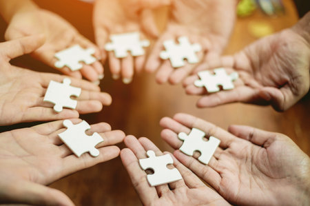 Jigsaw puzzles combine teamwork, unity and teamwork, achieving success in work and business growth.
