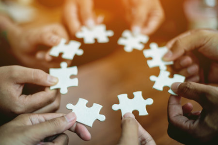 Jigsaw puzzles combine teamwork, unity and teamwork, achieving success in work and business growth.の写真素材
