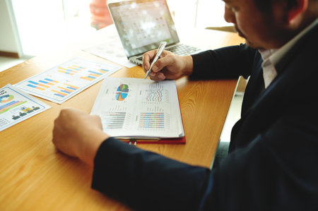 Financial planning and investment, working with financial documents and financial charts, earning moneyの写真素材