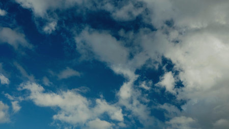 Cloud and sky view from above, and changes in daytime weather patterns.の写真素材