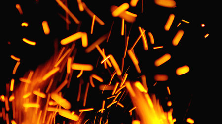 Sparks from the fireplace, the combustion of fuel from a charcoal stove, and lighting fires at night.の写真素材