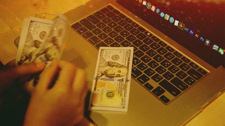 Counting dollars, earning income from work, and financial planning and investment.の写真素材