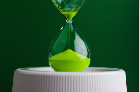 The green hourglass countdown timer represents the concept of time and efficient time management.の写真素材