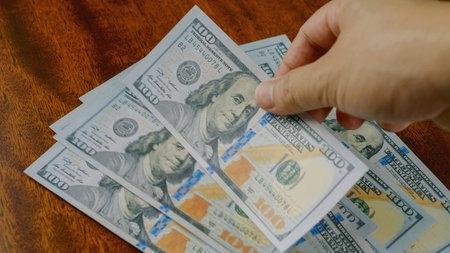 Dollar currency and financial investments, income from work and cash flow, financial success goals.の写真素材