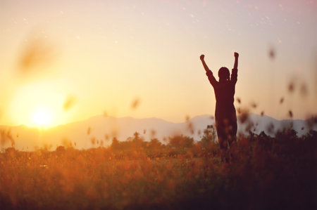 Silhouettes represent victory and success in work, a free and relaxed life in harmony with nature.の写真素材
