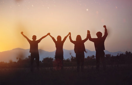 Silhouettes represent victory and success in work, a free and relaxed life in harmony with nature.の写真素材
