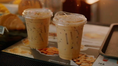 An iced espresso, coffee mixed with milk and lightly sweetened. Drinking coffee contains caffeine, which increases dopamine in the brain and body.の写真素材