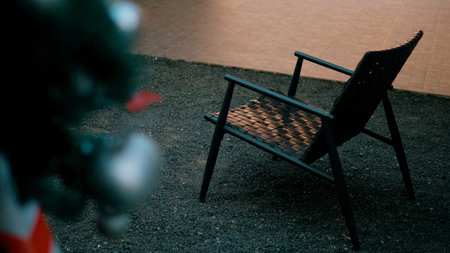 A black chair and the emptiness, the isolation, the loneliness, the solitude. Cinematic photography.の写真素材