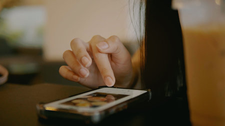 Using smartphones to search for information and to utilize social media effectively.の写真素材