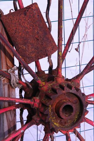 Antique Wagon Wheel and Cow Bell at rest in Wisconsinの写真素材