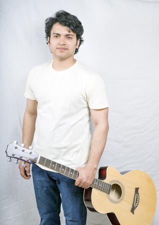 indian male model holding guitarの写真素材