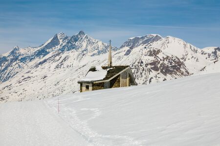 Chapel on the snow mountainの写真素材