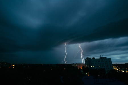 Lightning storm in Minsk, thunderstorm in dark skies