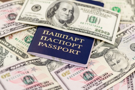 Belarusian passport and banknotes with wood deck background.の写真素材