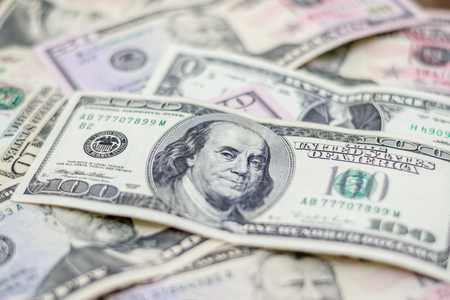 Mixed US dollars, a lot of money background.