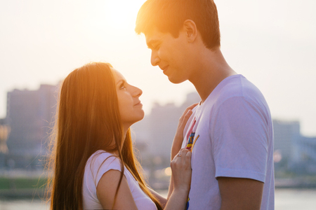 Happy couple in love having fun outdoors and smiling.の写真素材