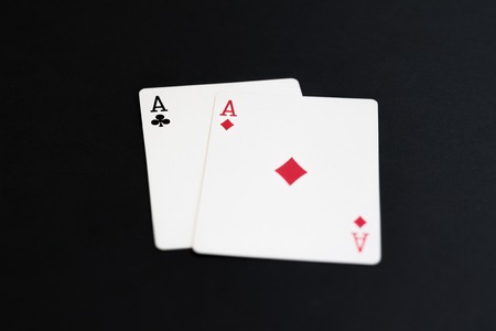 Playing poker cards aces on black background.の写真素材