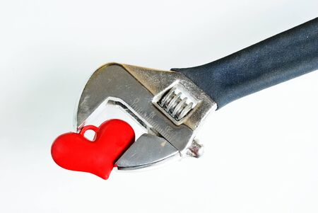 Adjustable Wrench with heart on isolated white backgroundの写真素材
