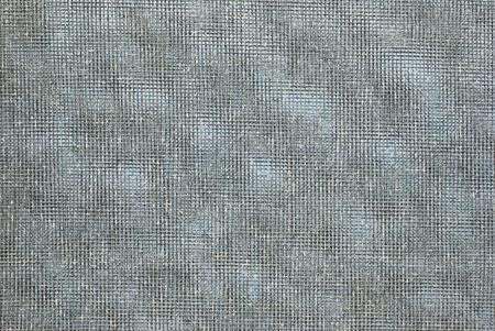 Close up on the old mosquito wire screen backgroundの写真素材