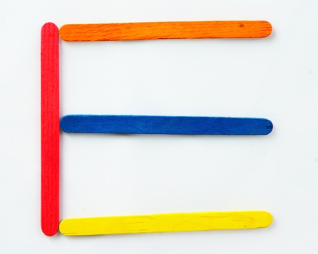Colorful wood bar separated to E consonant on isolated whiteの写真素材
