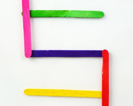 Colorful wood bar separated to S consonant on isolated whiteの写真素材