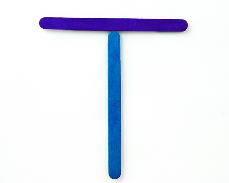 Colorful wood bar separated to T consonant on isolated whiteの写真素材