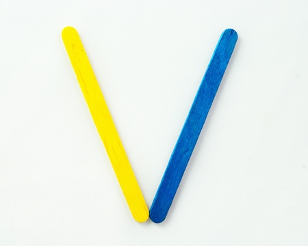 Colorful wood bar separated to V consonant on isolated whiteの写真素材