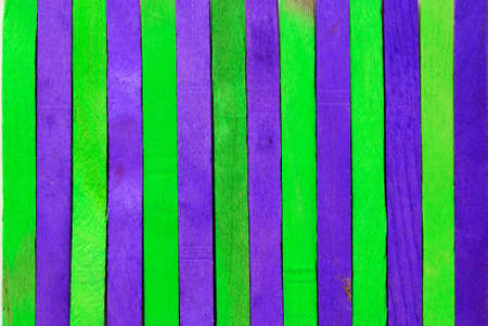 Green and purple wood separated to backgroundの写真素材