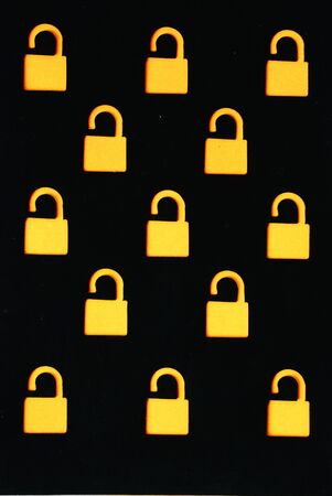 Many orange lock on black color backgroundの写真素材