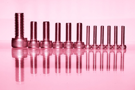 Procedure of engineering concept assume from bolt row with red filterの写真素材