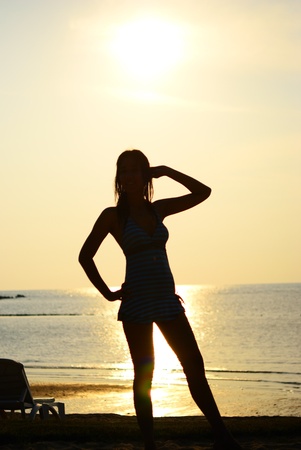 Silhouette of Asian woman pose on the beach in Thailand (KO Chang)の写真素材
