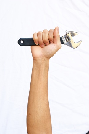 The strong hand hold the adjustable wrenchの写真素材