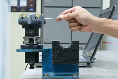 Try to lock insert of face milling toolの写真素材
