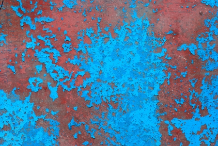 Old metal plate with blue peeling paintの写真素材