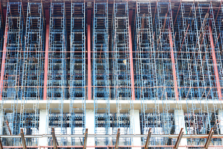 Many of blue scaffolding for build a big construction