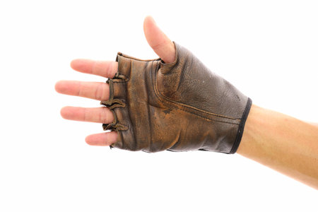 Hand and leather glove on action with isolated whiteの写真素材