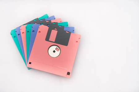 Colorful floppy disc on isolated white backgroundの写真素材