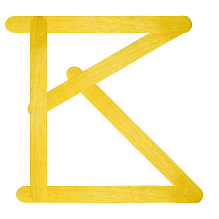B English alphabet by yellow wood on isolated white backgroundの写真素材