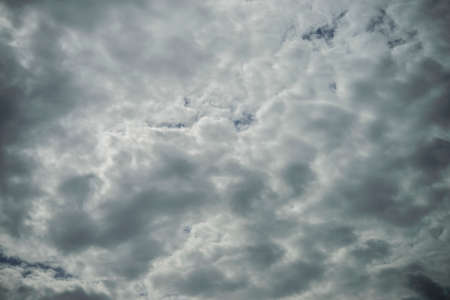 Dark sky background before raining with many of cloudsの写真素材