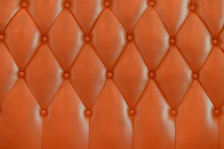 Orange leather texture from sofa for backgroundの写真素材