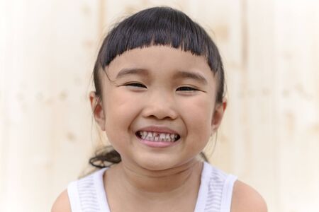 Kid smiling with caries on blur backgroundの写真素材