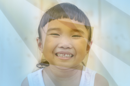 Kid smiling with caries on blur background