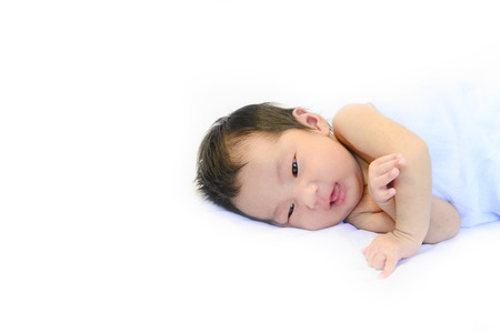 Baby portrait with smiling on white backgroundの写真素材