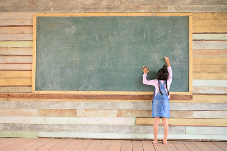 Kid write back to school font on old green chalkboardの写真素材
