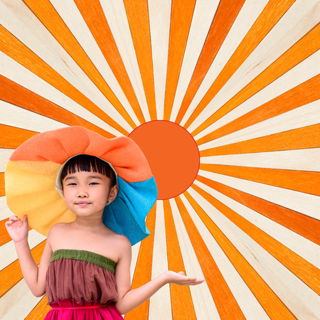 Little girl fashion portrait for summer with orange wood backgroundの写真素材