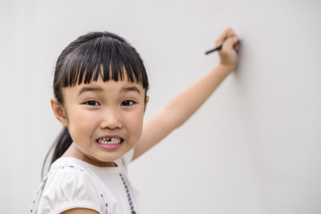 Kid talent and writing on the wallの写真素材